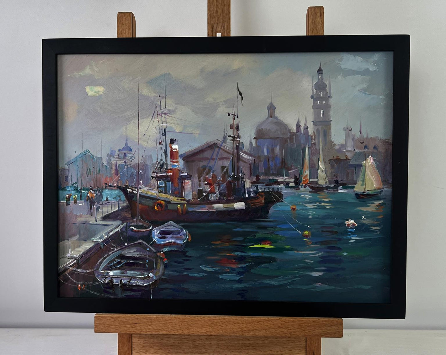 Framed oil painting by Yuriy Suprunchuk of boats at city pier harbor