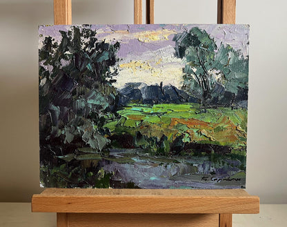 Oil painting In the Evening on the Meadow by Boris Serdyuk, lush fields and purple sky