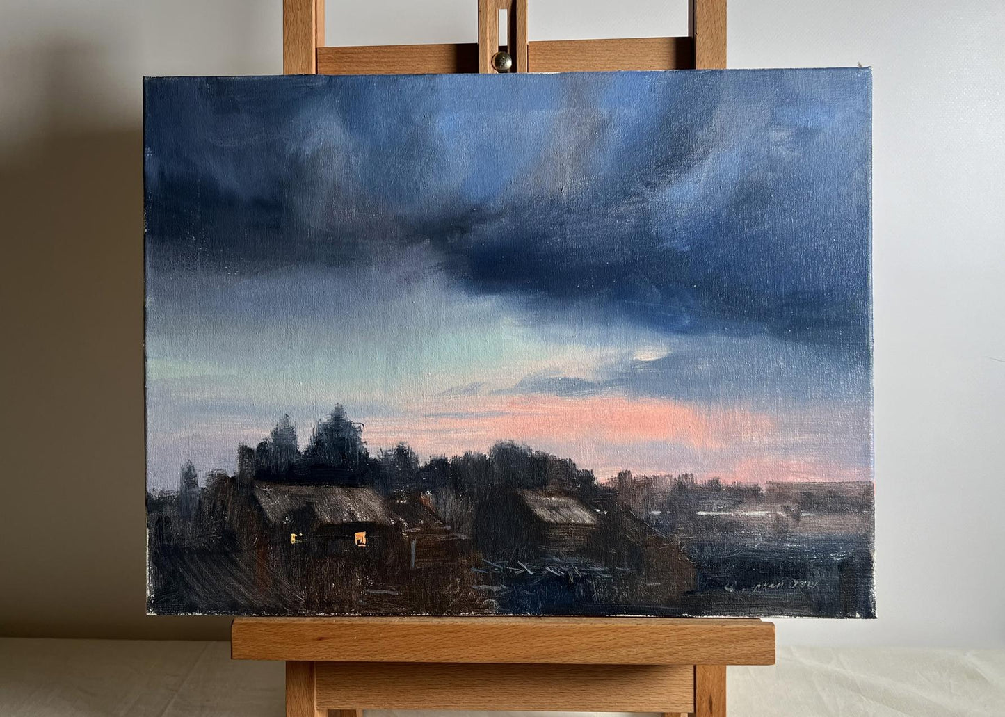 Oil painting Northern Lights over village by Tatyana Derdey on easel