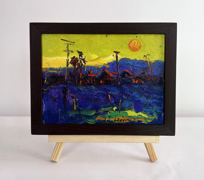 Oil painting Yellow sunset over the village by Oksana Ivanyuk in black frame
