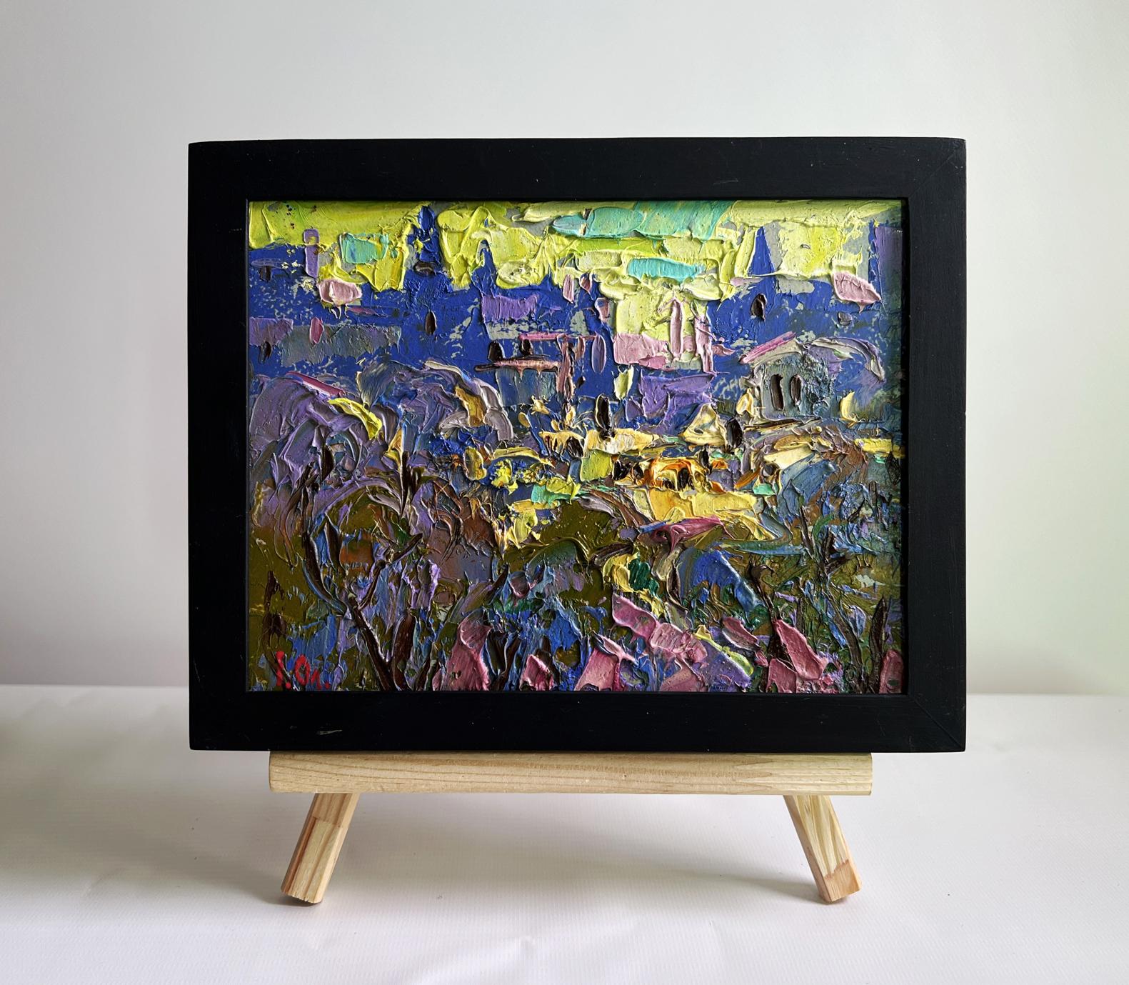 Oil painting by Oleksiy Ivanyuk: yellow sunset over city in black frame