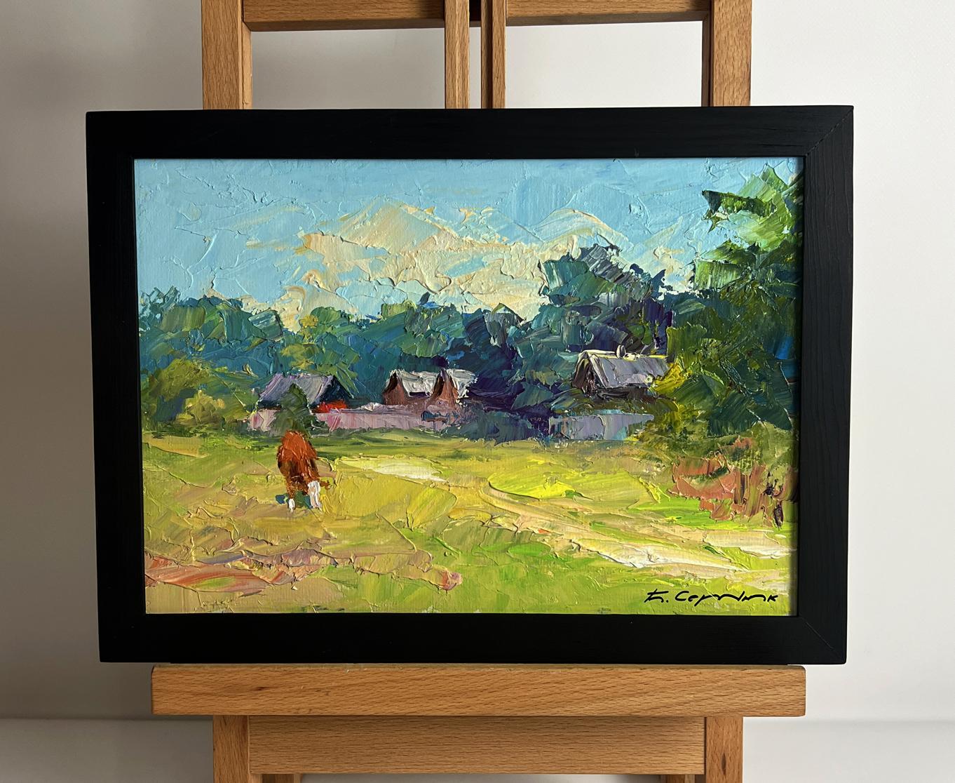 Framed oil painting of red cow near houses by Boris Serdyuk in black frame