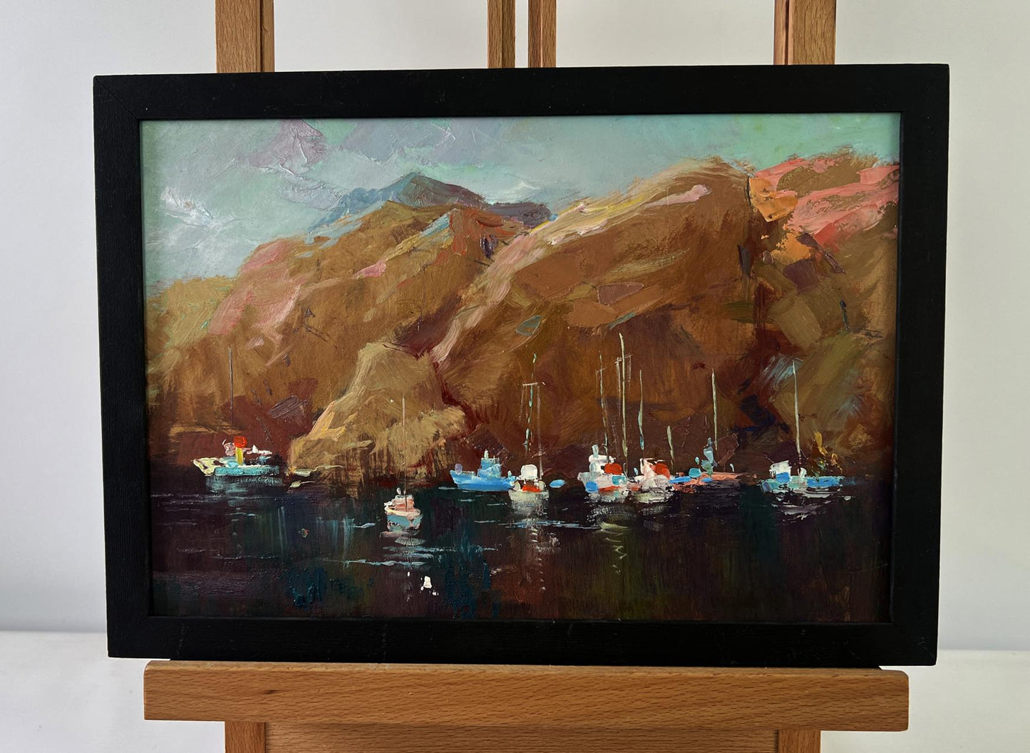 Oil painting Sails against mountains by Yuriy Suprunchuk, harbor boats and cliffs