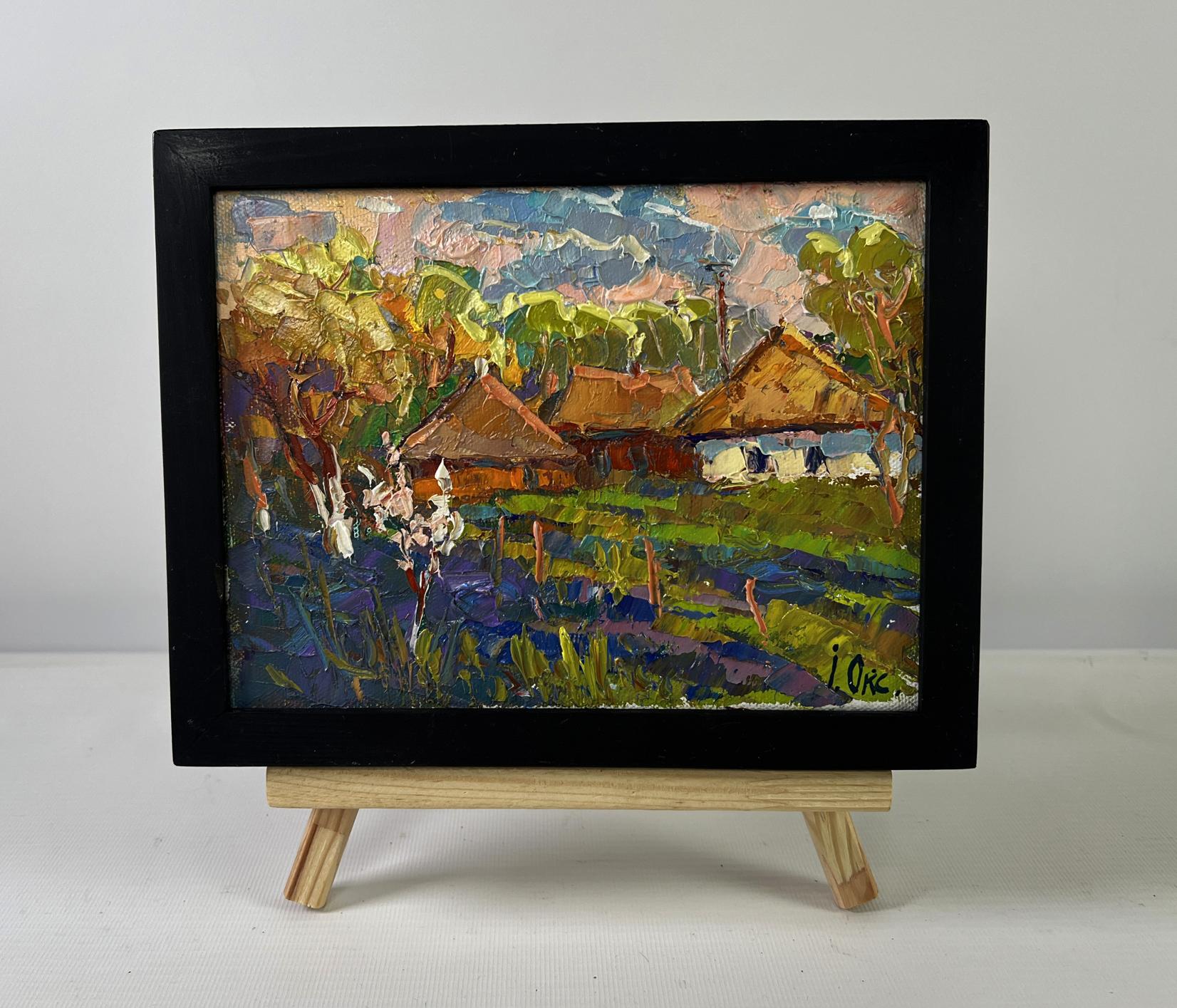 Black-framed oil painting of Oksana Ivanyuk village scene in vibrant greens
