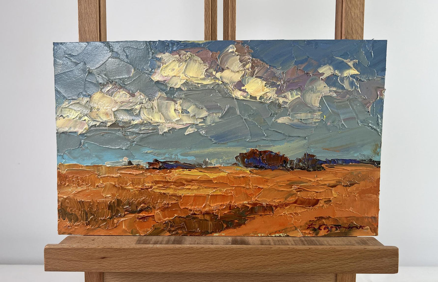 Oil painting Where There Is Bread There Is a Home by Boris Serdyuk, golden field under dramatic sky