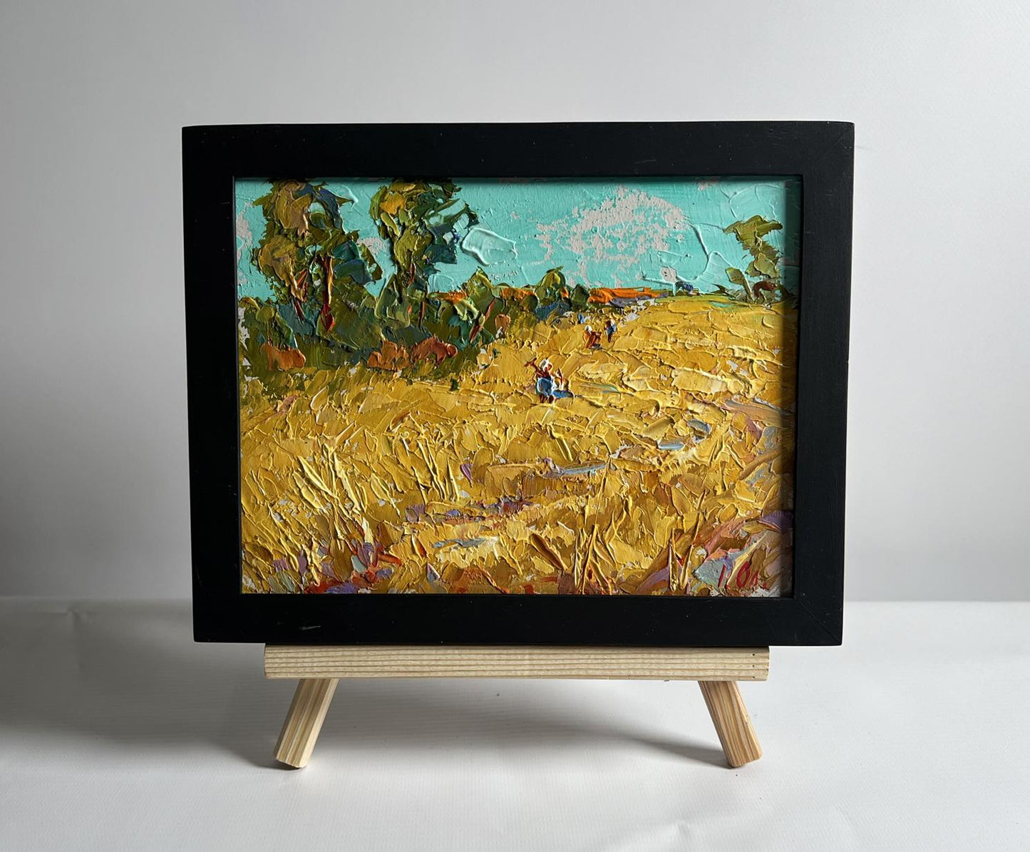 Oil painting Sunny day in the field by Oleksiy Ivanyuk on wooden easel