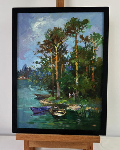 Framed oil painting by Yuriy Suprunchuk: forest to serene lakeside with boats