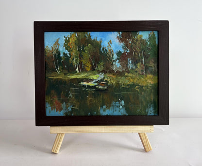 Oil painting Flowing among the trees by Yuriy Suprunchuk on easel