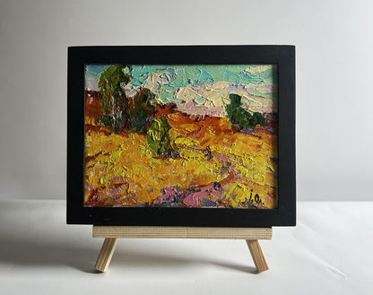 Oil painting A light breeze in the field by Oleksiy Ivanyuk, golden field scene