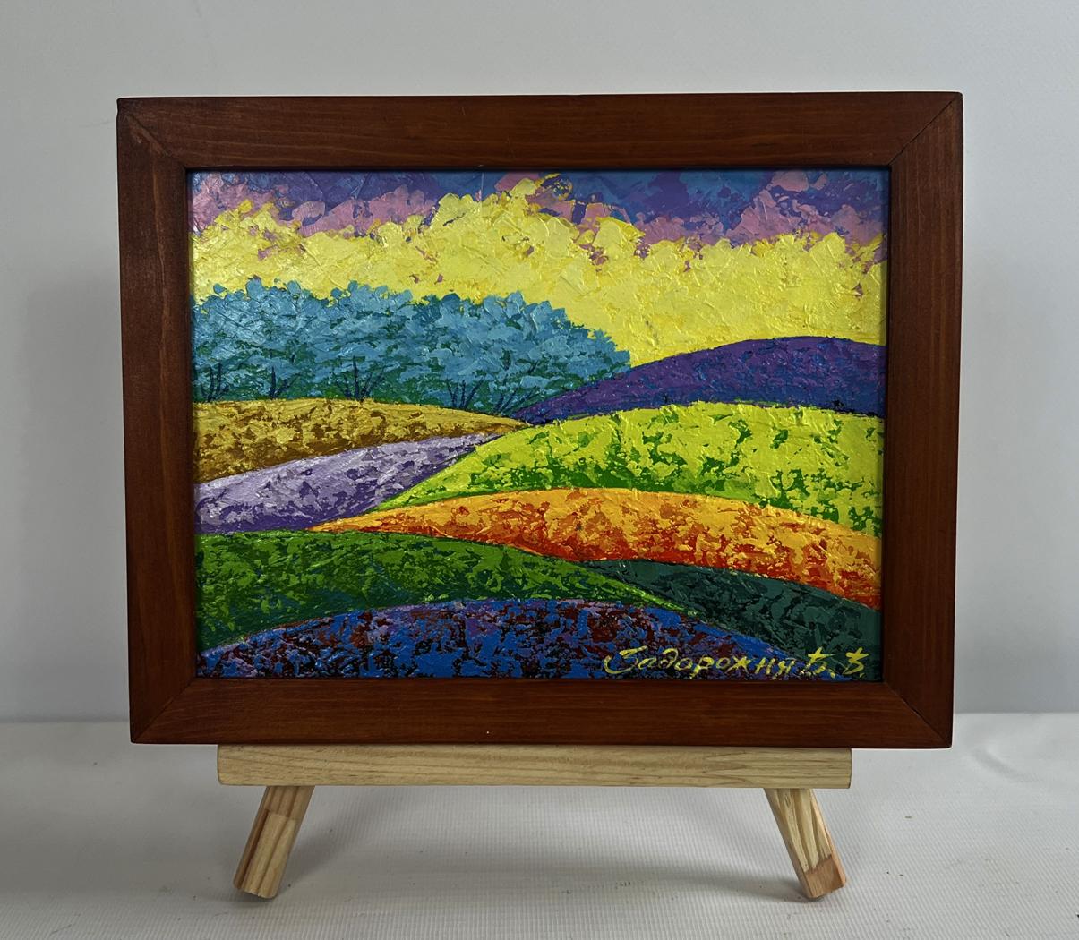 Vibrant textured oil painting of fiery sky over green forest by V. Zadorozhnya in wooden frame