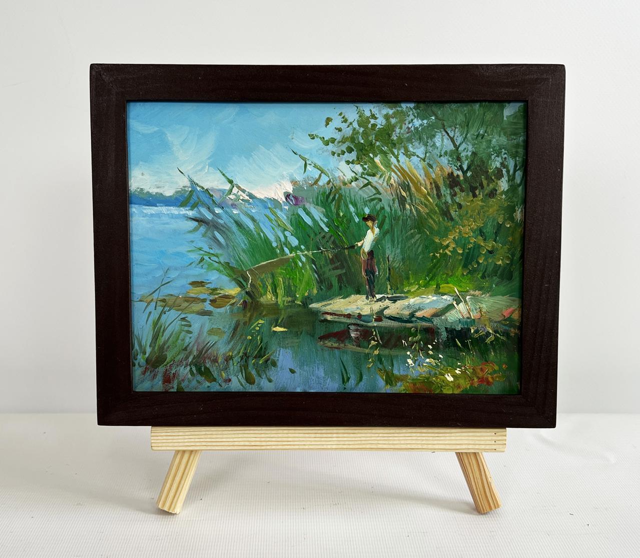 Oil painting of good fishing catch by Yuriy Suprunchuk in wooden frame on easel