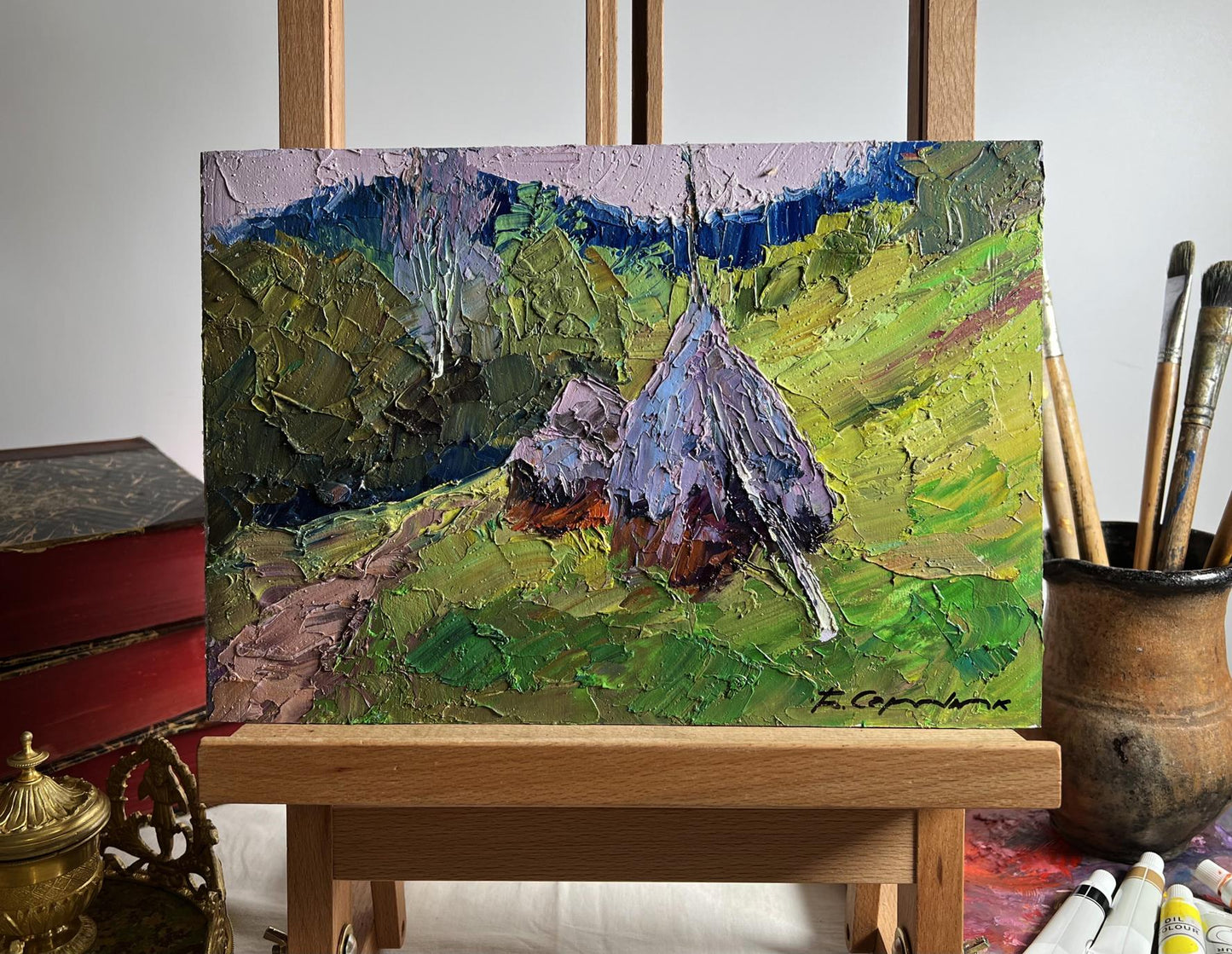 Oil painting Path to the mountains by Boris Serdyuk, purple haystack in green fields