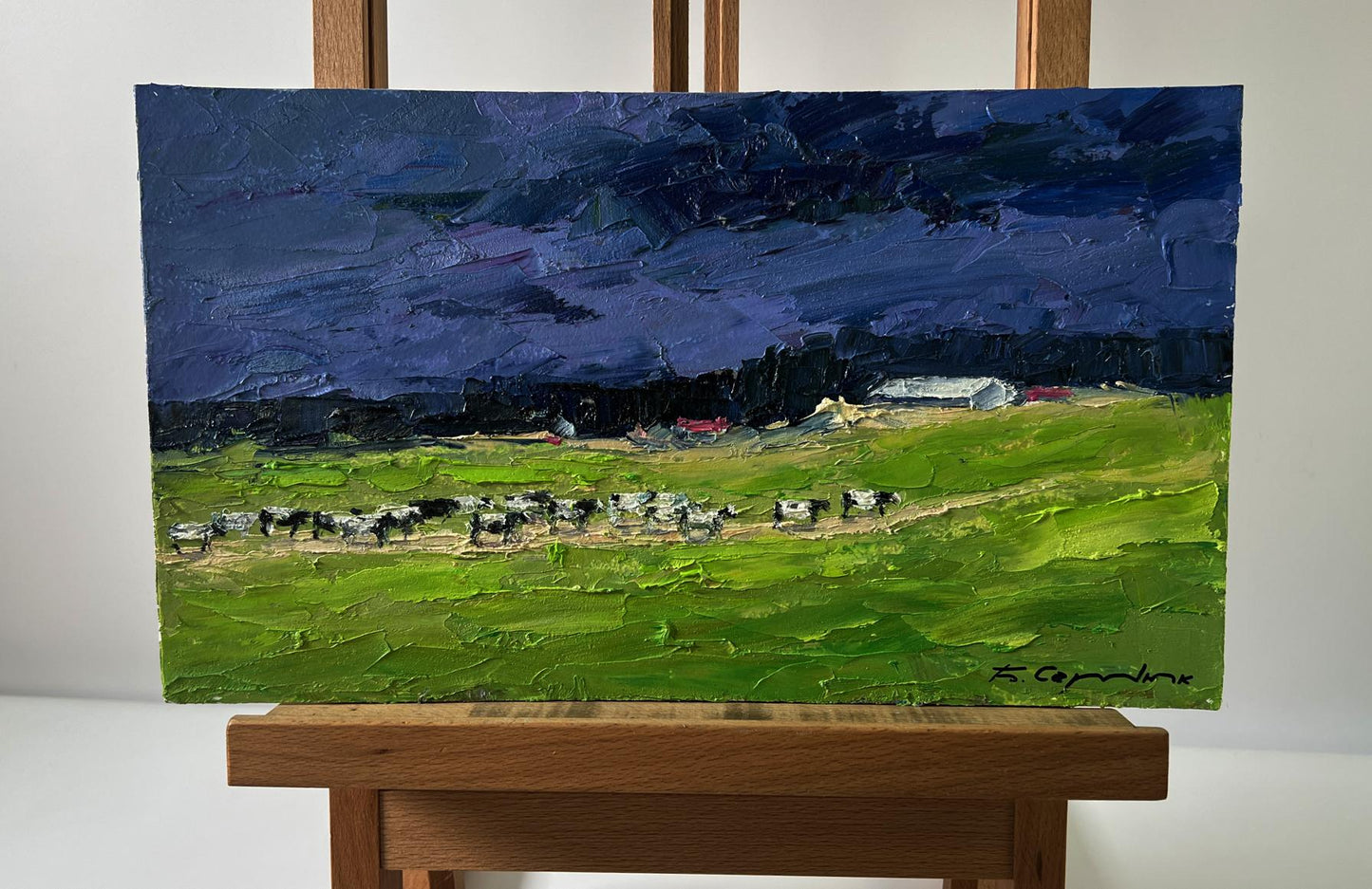Oil painting Evening field by Boris Serdyuk on wooden easel