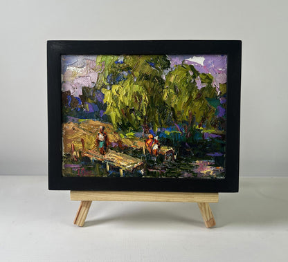 Oil painting Vacations in the village sun by Oleksiy Ivanyuk in black frame