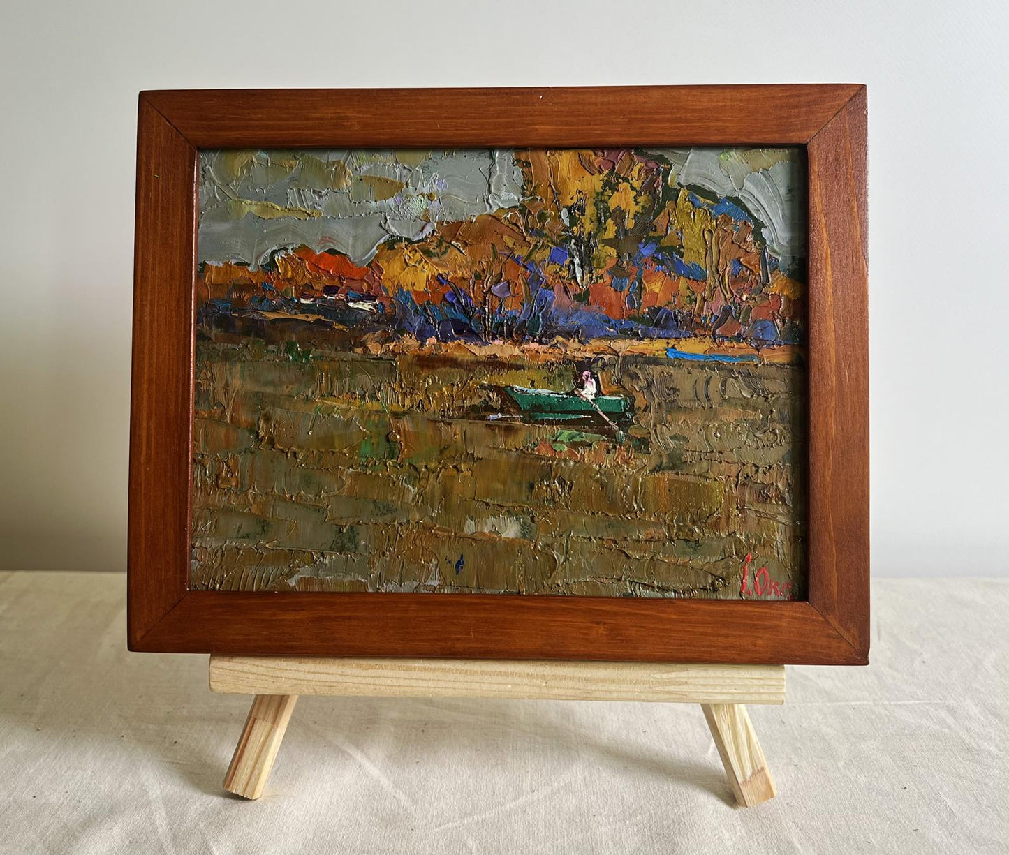 Oil painting Autumn evening silence by Oksana Ivanyuk: green boat on earthy water