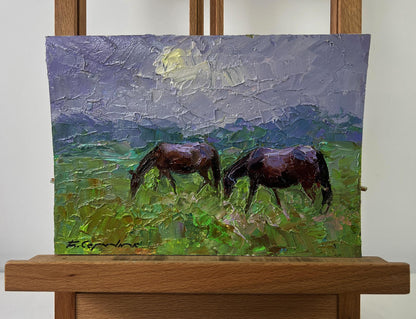 Oil painting of two brown horses grazing by Boris Serdyuk