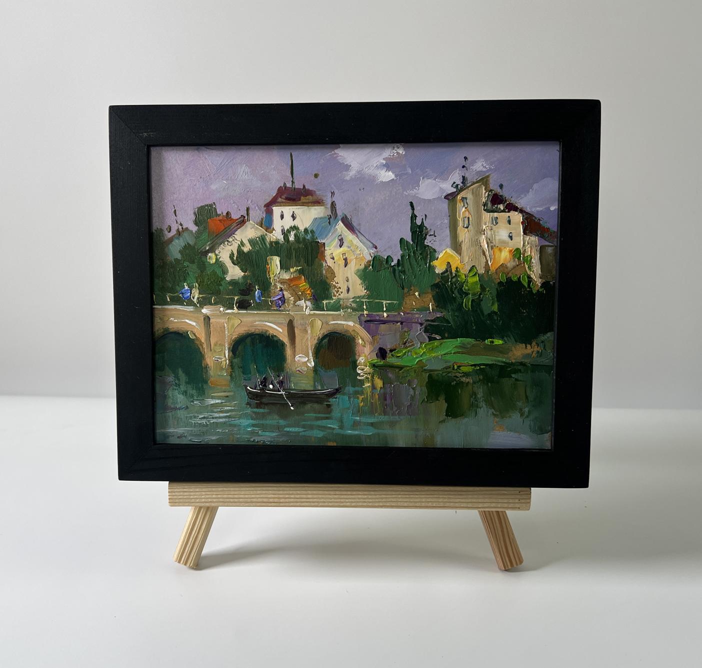 Oil painting City bridge by Yuriy Suprunchuk on wooden easel