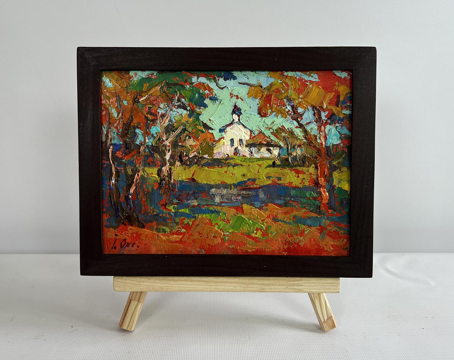 Vibrant oil painting of autumn church tower bell ringing by Oksana Ivanyuk