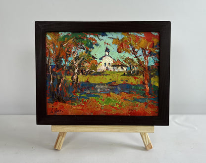 Vibrant oil painting of autumn church tower bell ringing by Oksana Ivanyuk