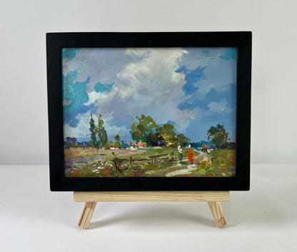 Black-framed miniature oil painting Past the outer houses by Yuriy Suprunchuk