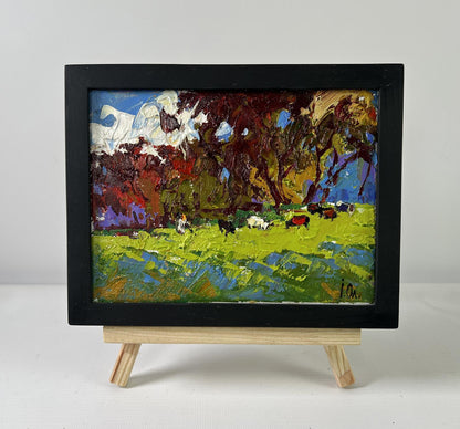 Oil painting Cows on the Meadow by Oleksiy Ivanyuk in black frame