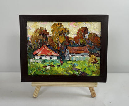 Oil painting Autumn yellow sunset by Oleksiy Ivanyuk in dark frame on easel