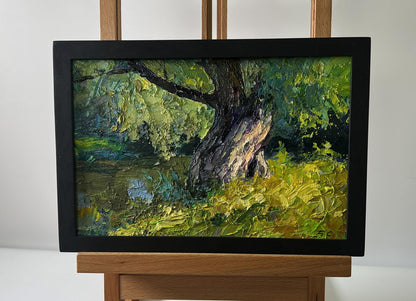 Black-framed oil painting of impressionistic tree near river by Boris Serdyuk