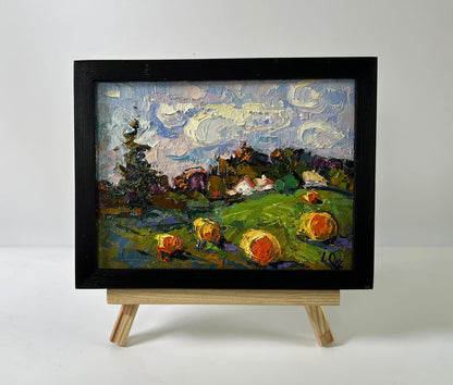 Oil painting Fresh hay of the village by Oksana Ivanyuk in black frame