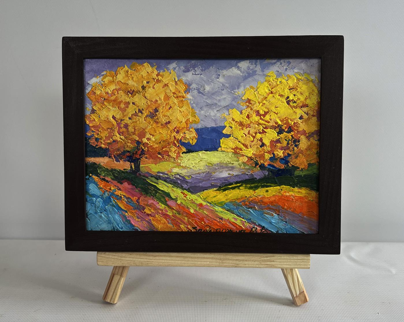 V. Zadorozhnya oil painting of two big autumn trees in field on easel