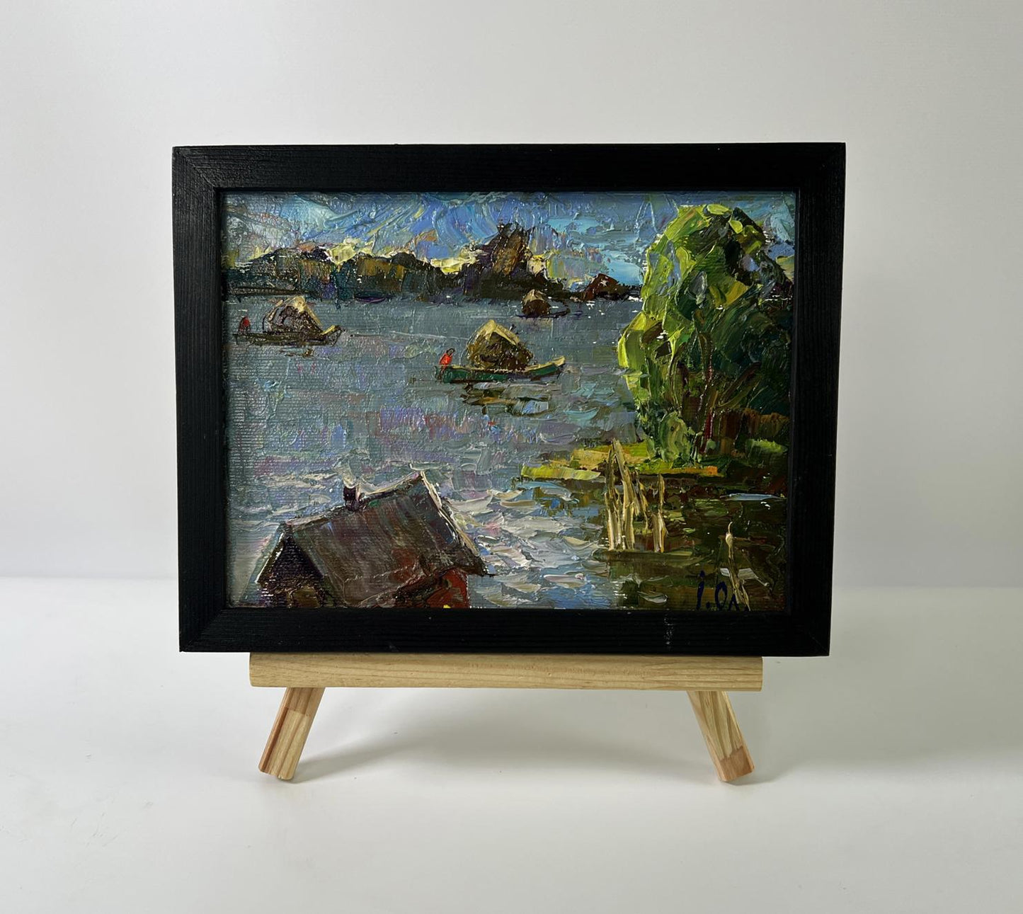 Oil painting Above the lake by Oleksiy Ivanyuk on wooden easel