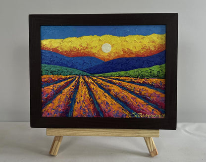 Oil painting of plowed field and blazing sunset by V. Zadorozhnya