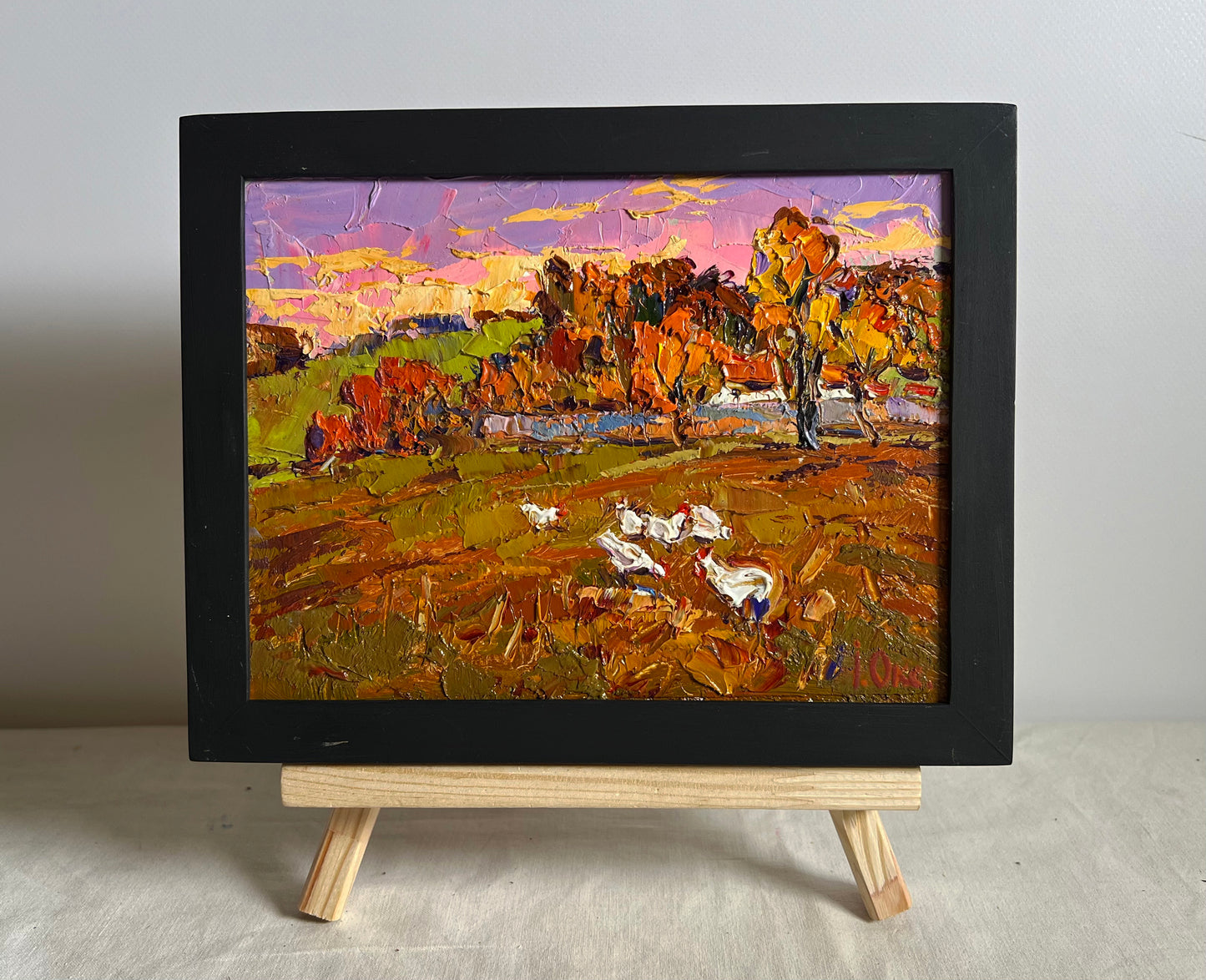 Oil painting Autumn evening by Oksana Ivanyuk: impressionist autumn landscape with white chickens on easel