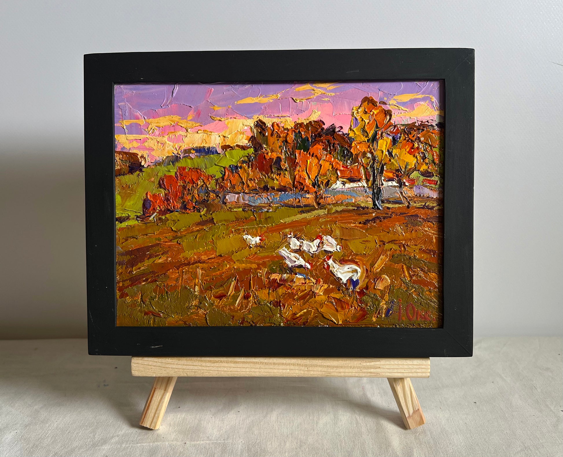 Oil painting Autumn evening by Oksana Ivanyuk: impressionist autumn landscape with white chickens on easel
