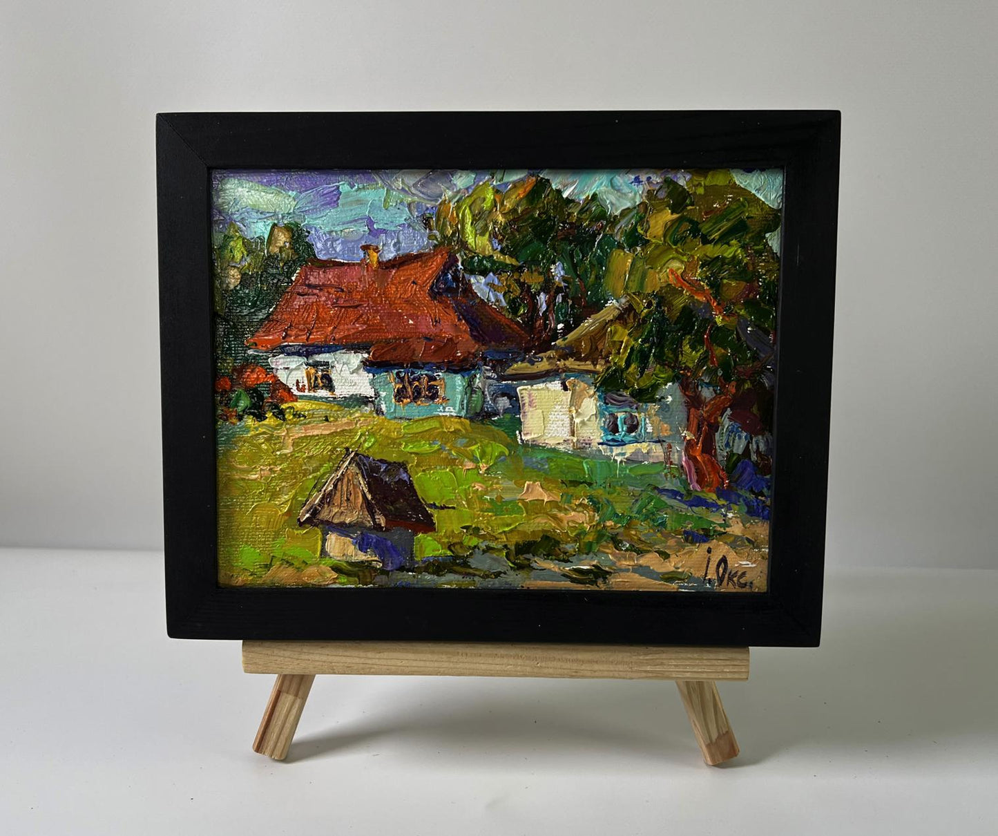 Oil painting Quiet village courtyard by Oksana Ivanyuk in black frame