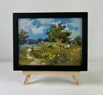Oil painting Afternoon on the pasture by Yuriy Suprunchuk on wooden easel