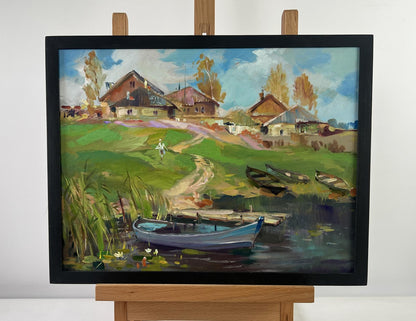 Framed oil painting of rural village with boats by Yuriy Suprunchuk