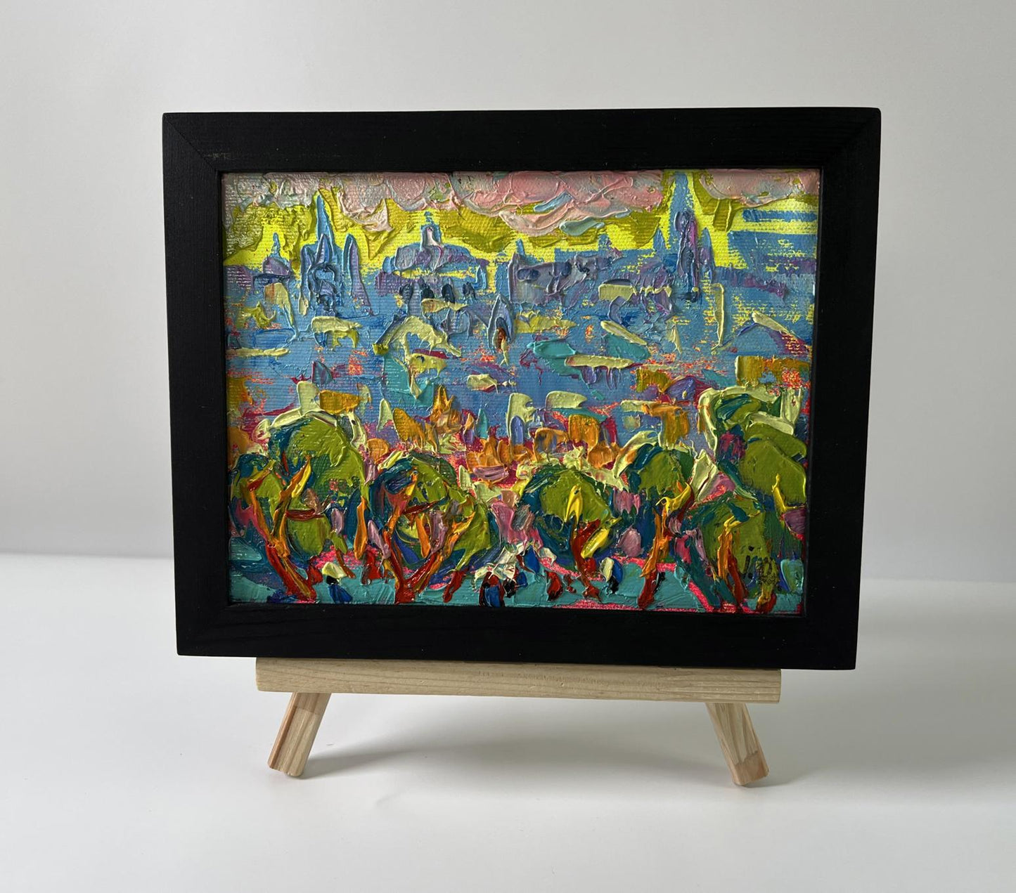 Oil painting Dynamics of the Solar City by Oleksiy Ivanyuk in black frame