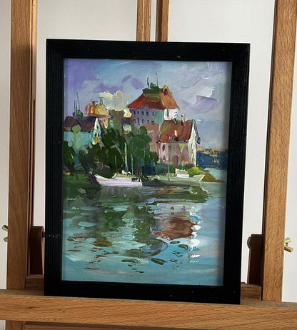 Framed impressionist oil painting of Yuriy Suprunchuk houses by the river