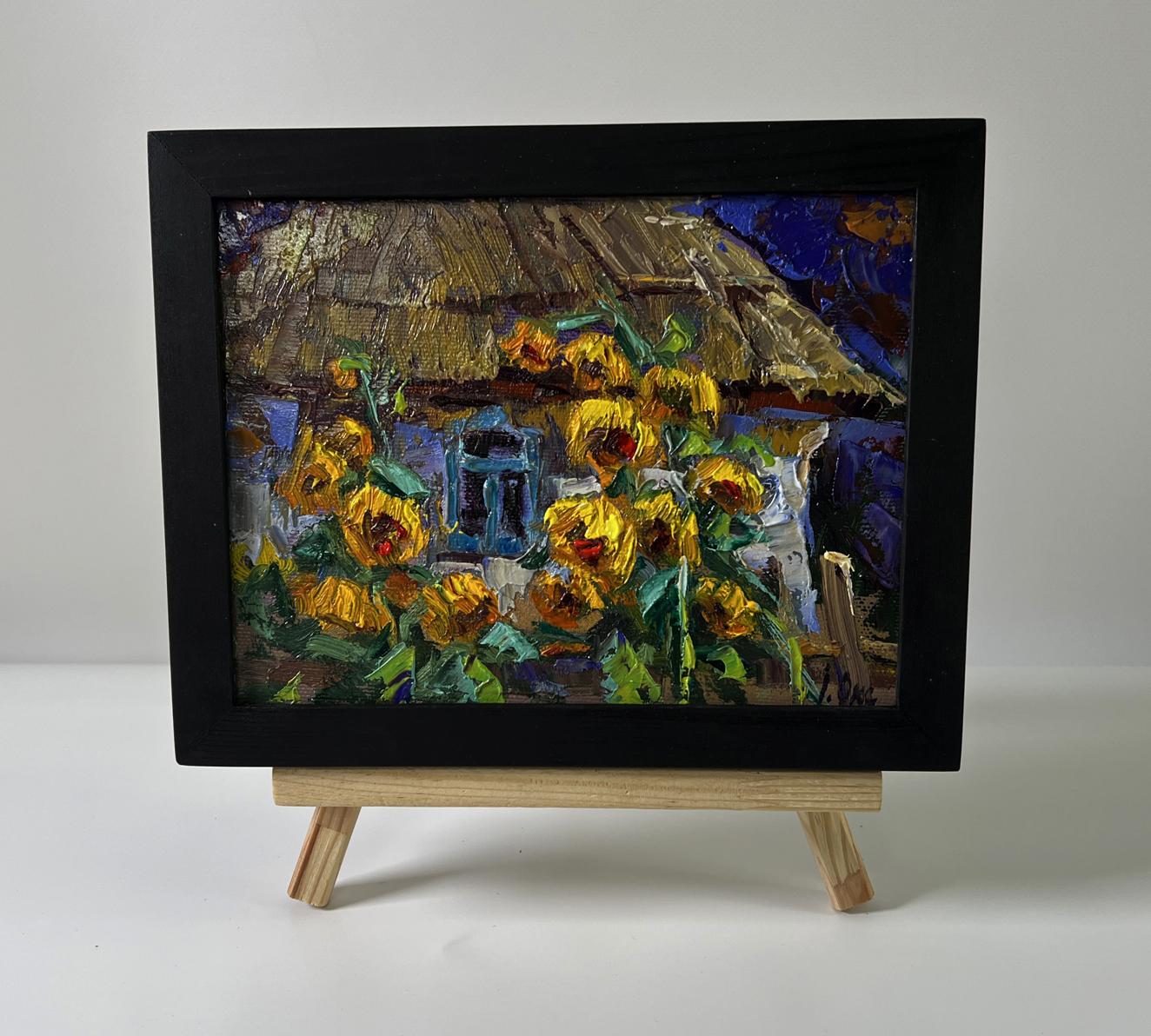 Oil painting Evening sunflowers by Oksana Ivanyuk in black frame on easel
