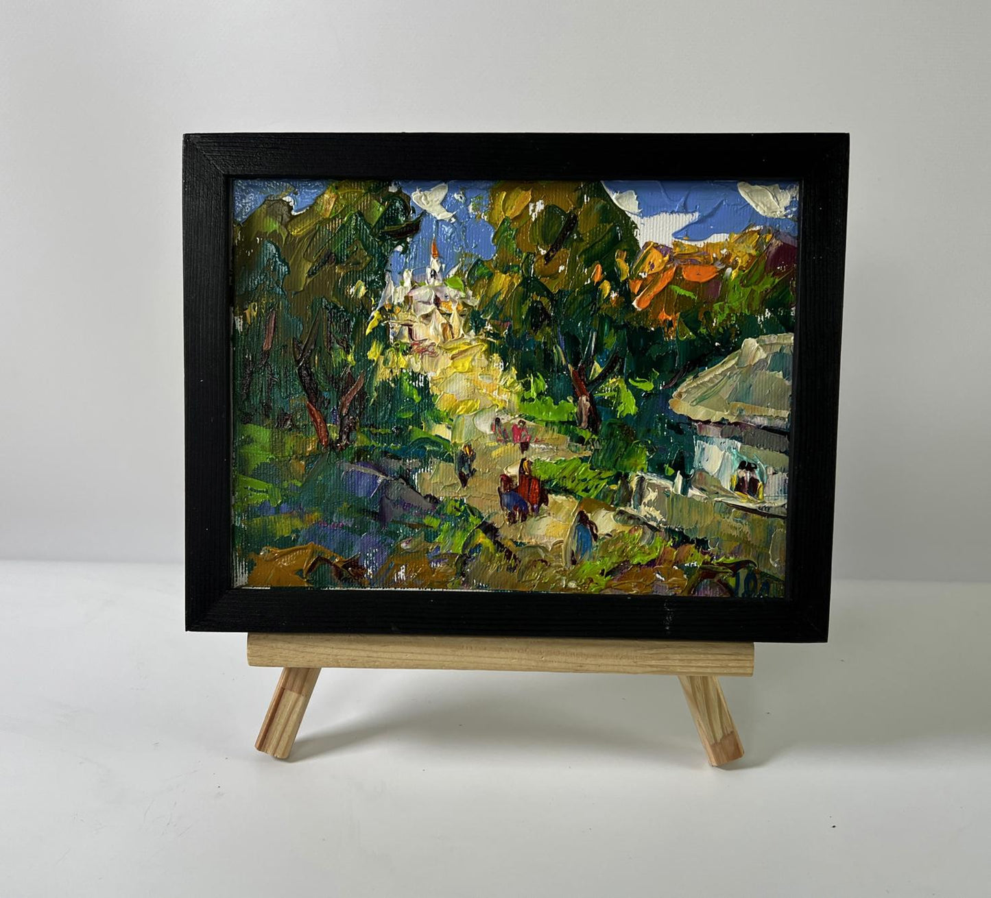 Oil painting Feast day in village by Oleksiy Ivanyuk in black frame