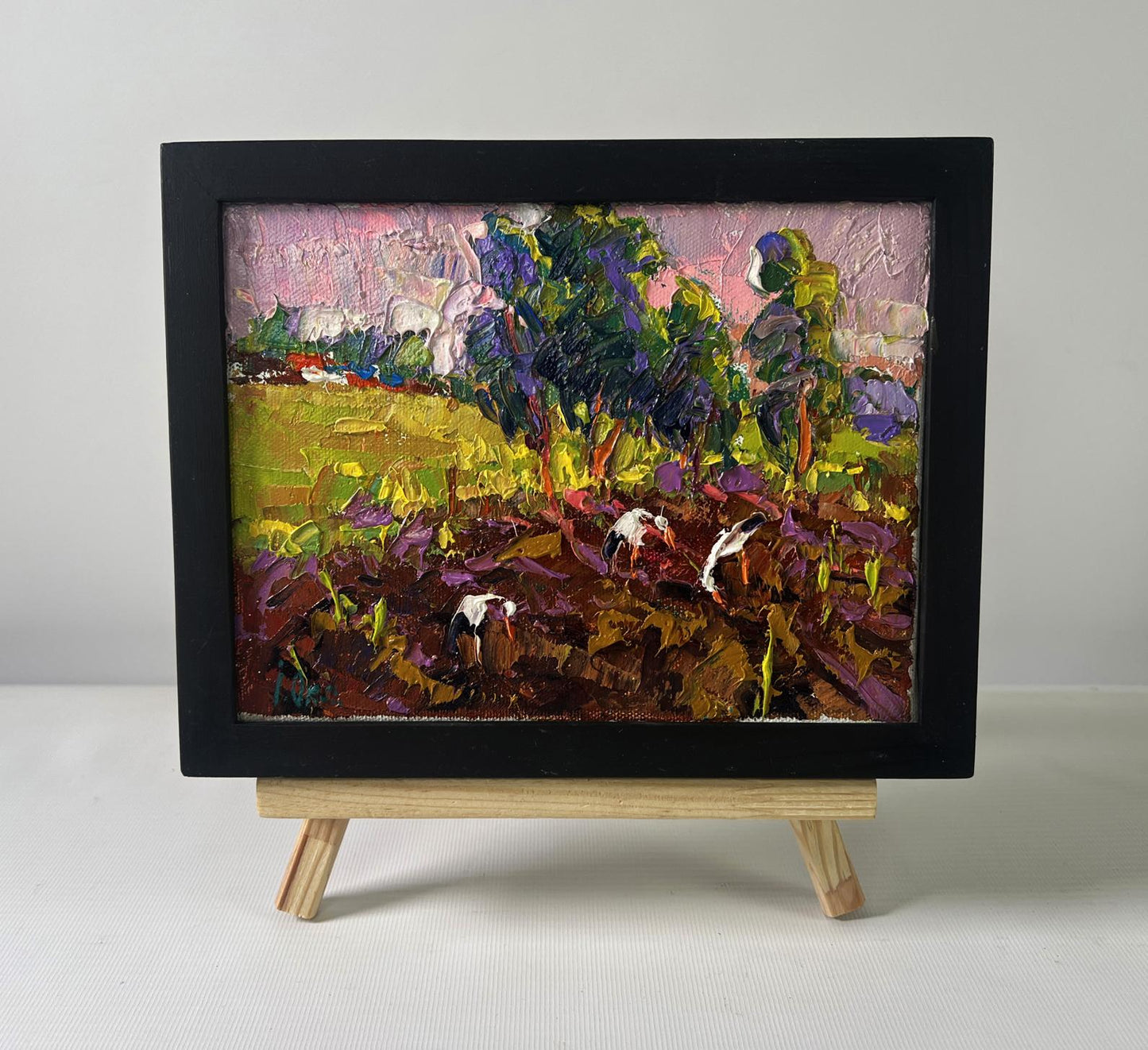 Vibrant impressionist oil painting by Oksana Ivanyuk: sunset pastoral scene in black frame