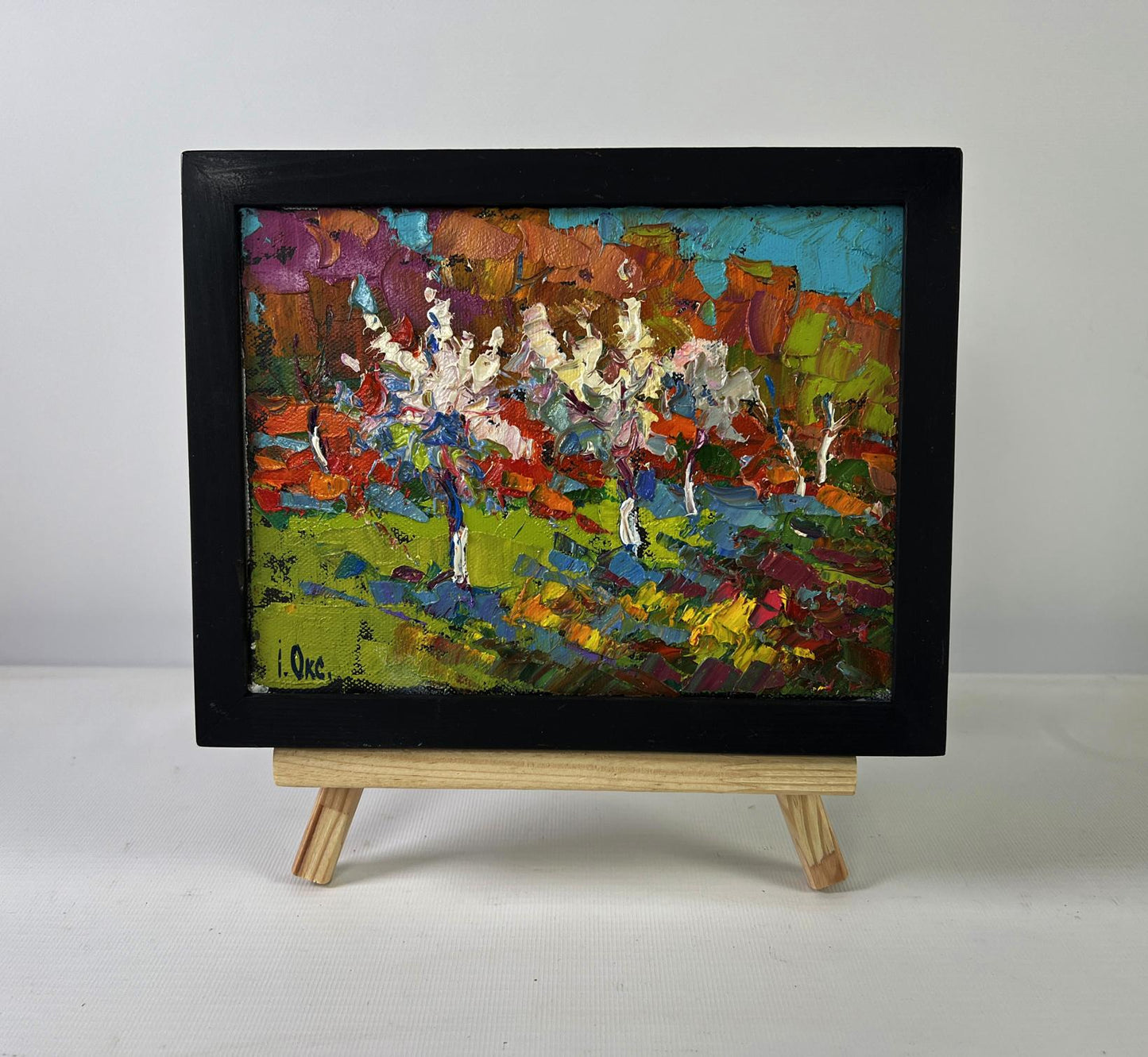 Oil painting of flowering trees in autumn garden by Oksana Ivanyuk