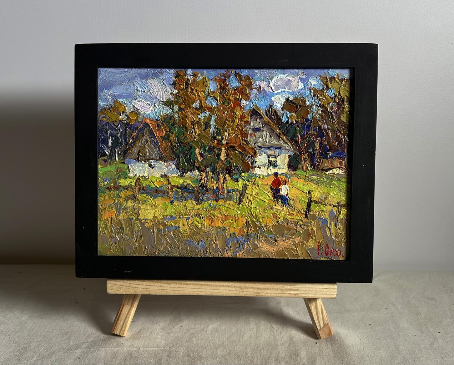 Oil painting Sunny courtyard by Oksana Ivanyuk in black frame on easel