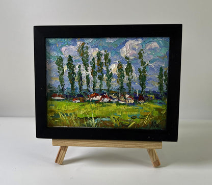 Oil painting Clouds over the village by Oksana Ivanyuk vibrant landscape