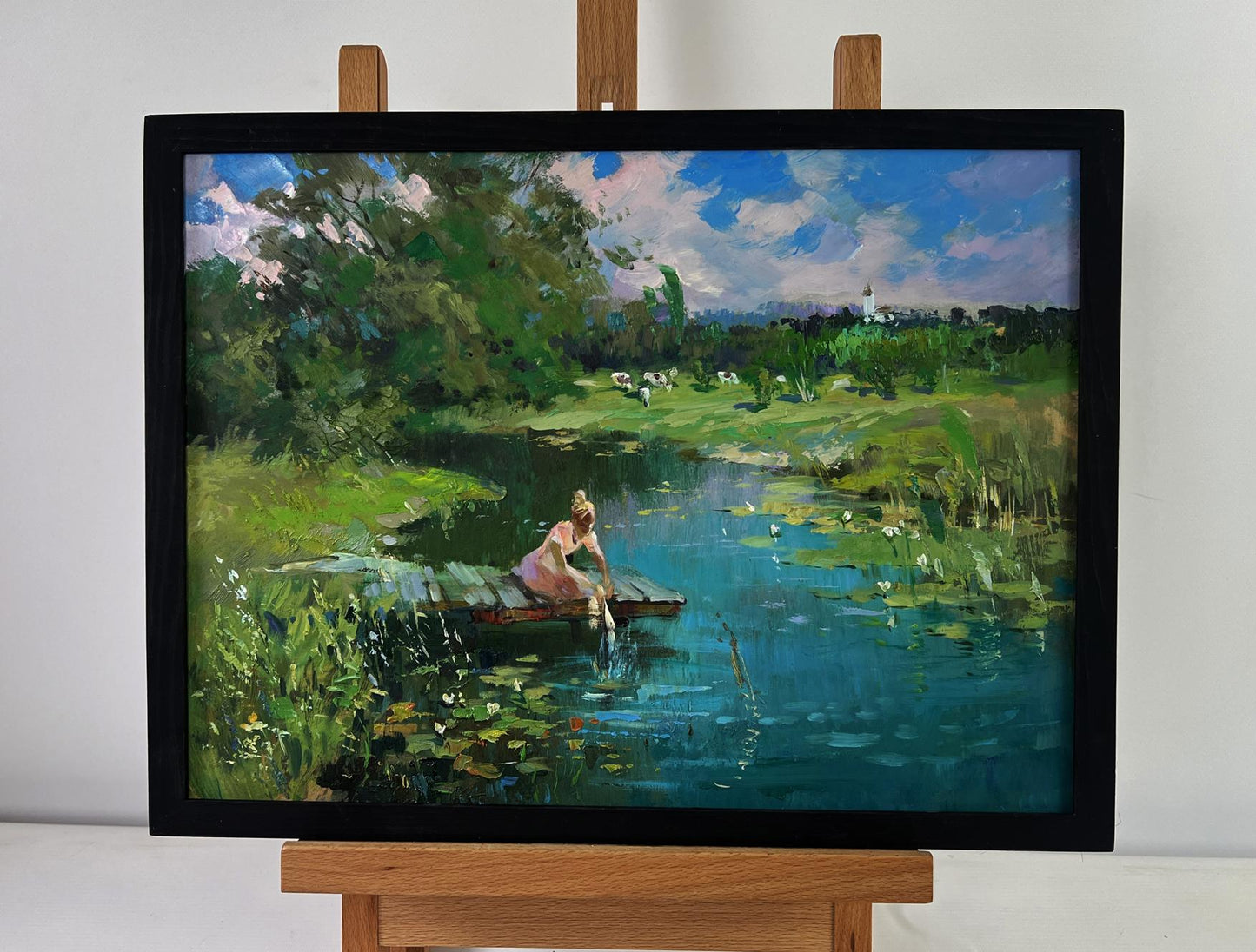 Oil painting by Yuriy Suprunchuk: girl in pink dress at lily-pad pond