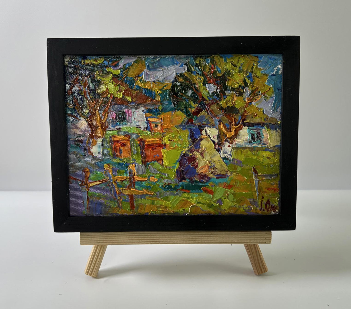 Oil painting Summer day in the village by Oksana Ivanyuk in black frame