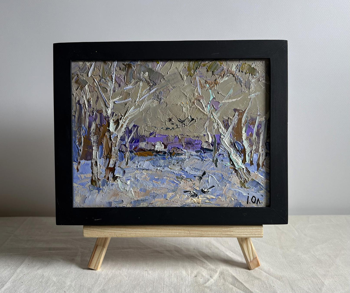 Oil painting Snowy path to the village by Oleksiy Ivanyuk, snowy textured landscape in black frame