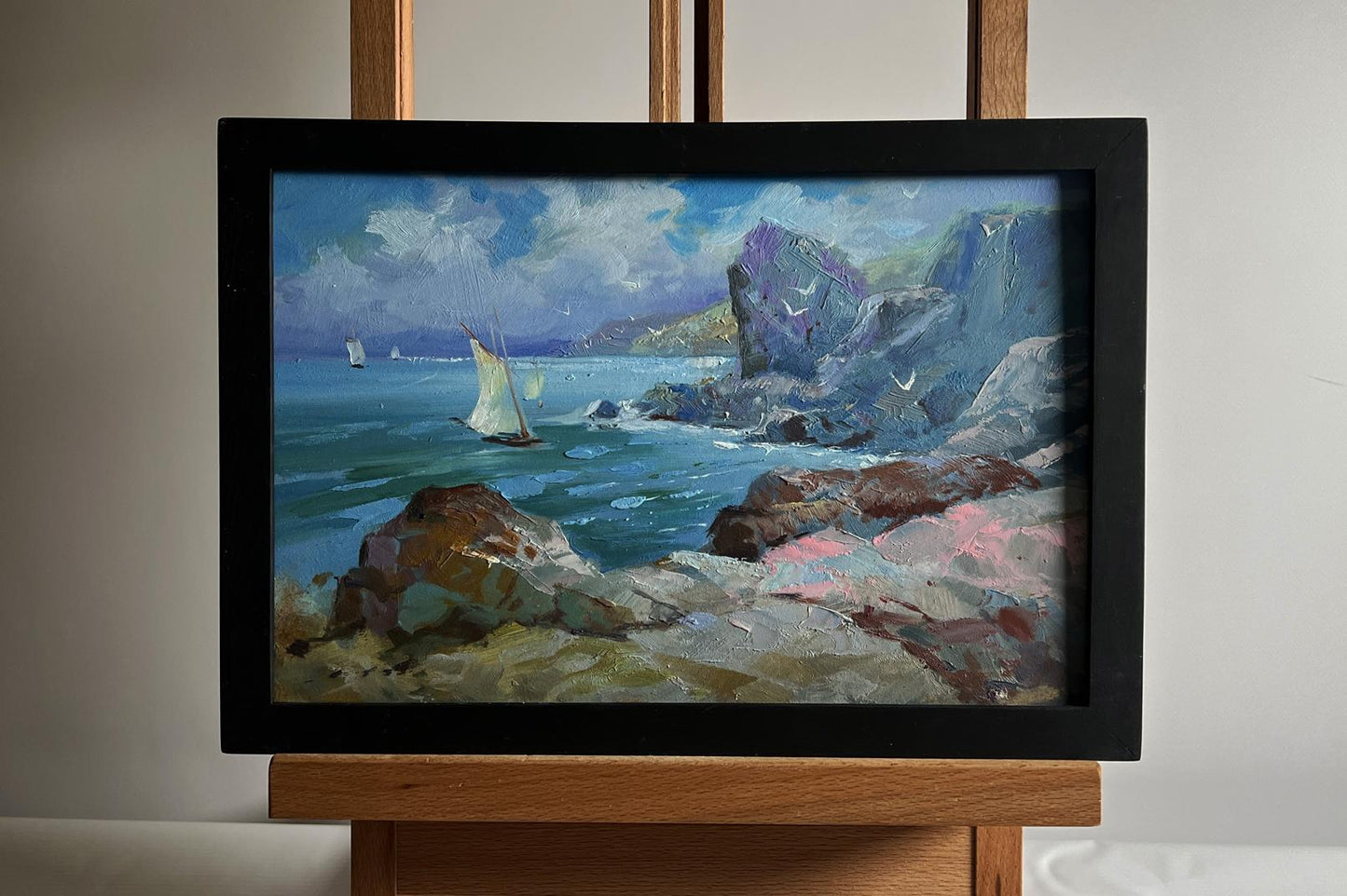 Framed oil painting by Yuriy Suprunchuk: seagulls, rocky shore, sailboats, cliffs
