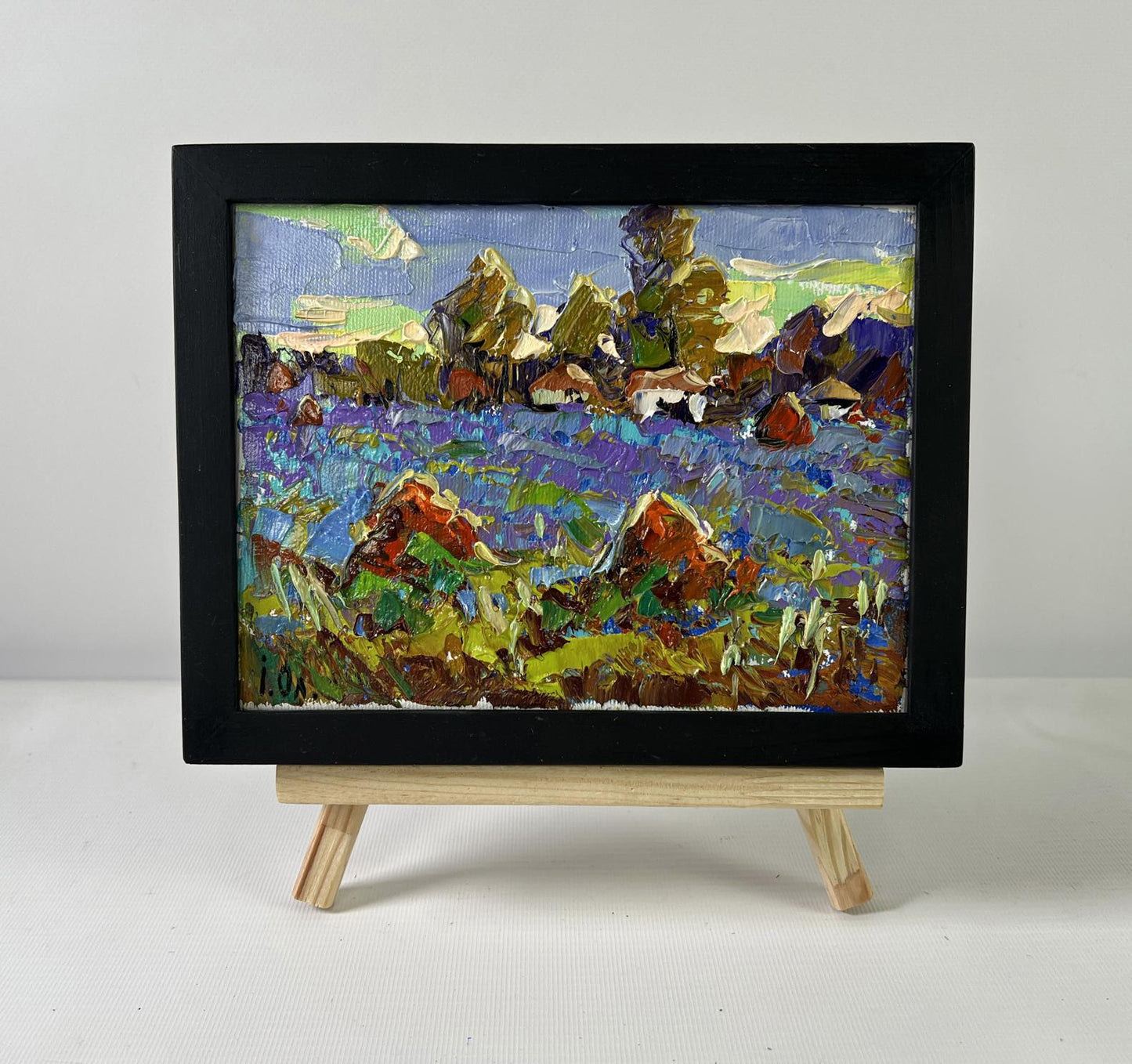 Oil painting Edge of the Village by Oleksiy Ivanyuk in black frame