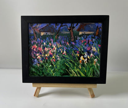 Oil painting Flowers in the village by Oleksiy Ivanyuk: vibrant irises